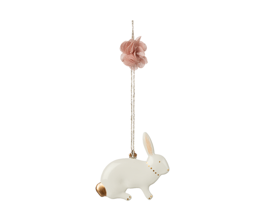 Decorative hanging rabbit ornament with pink flower on a white background