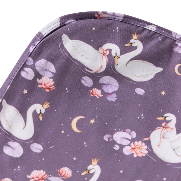 Purple fabric with swan and lily pad pattern