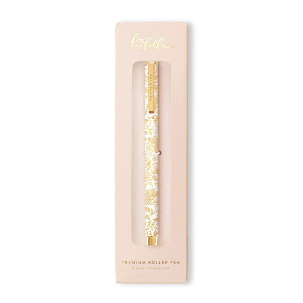Gold roller pen in a decorative box with 'loella' branding on a white background