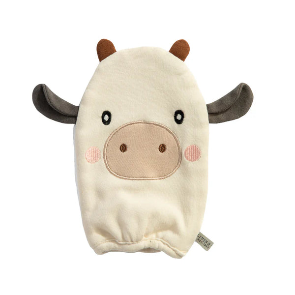 Plush toy shaped like a cow on a white background