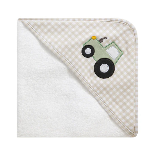 Hooded towel with checkered border and tractor applique on a white background