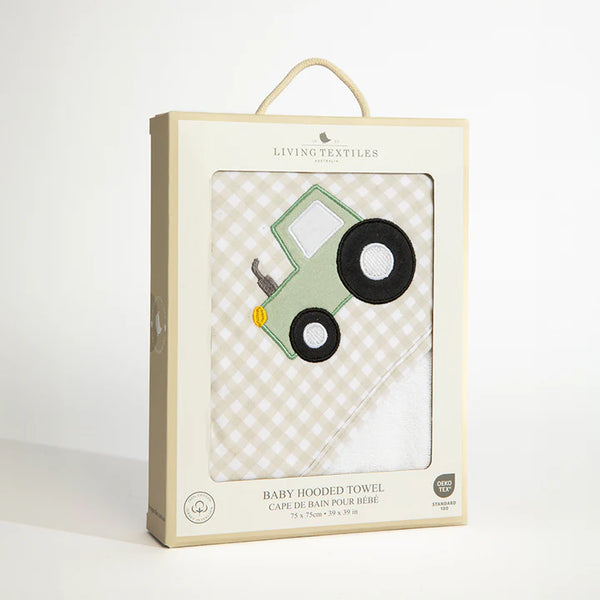 Packaged baby hooded towel with car design on a white background