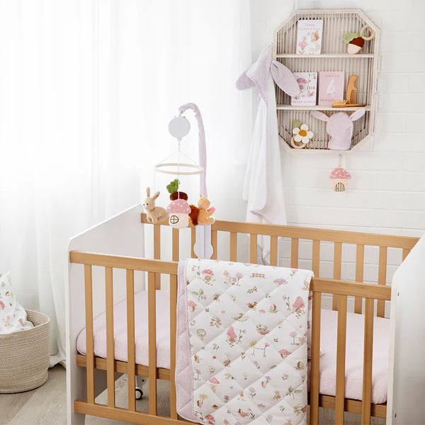 Nursery room with wooden crib and decorative items