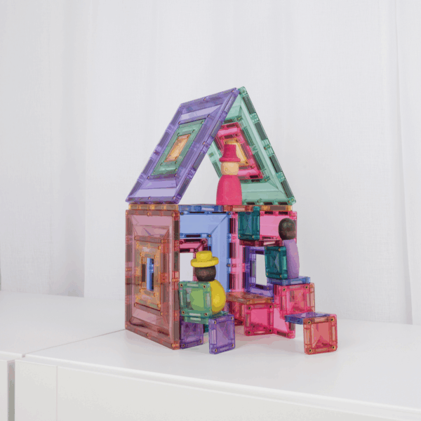 Colorful magnetic building blocks on a white surface