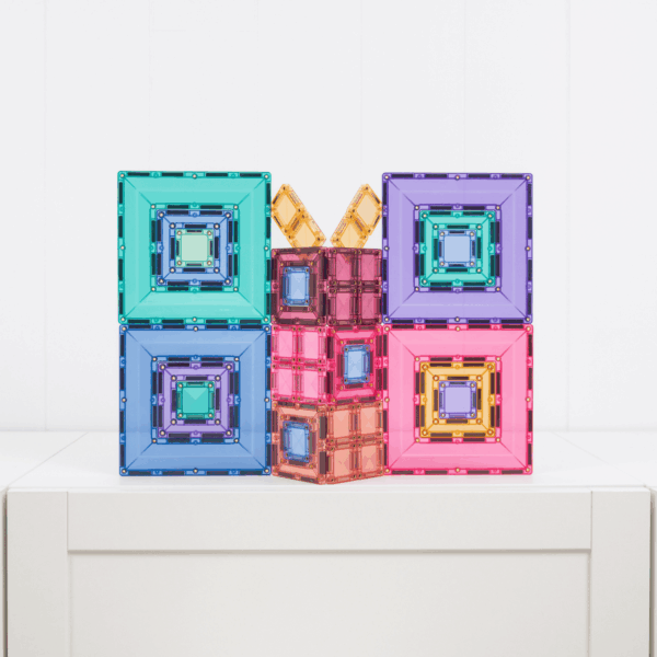 Colorful geometric building blocks on a white surface