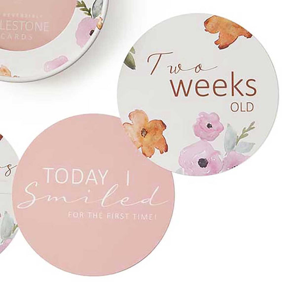 Round milestone stickers with baby-themed designs on a white background