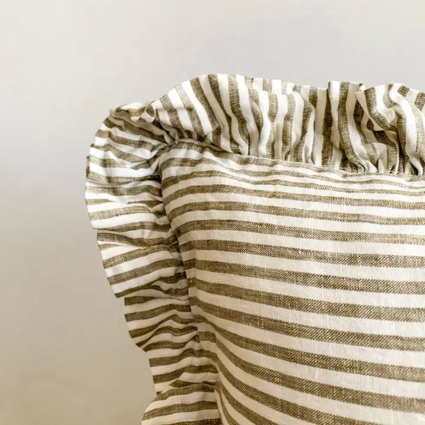Striped fabric with brown and white stripes on a neutral background