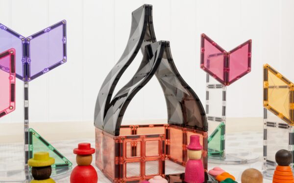 Colorful geometric building blocks with a transparent black structure on a light background