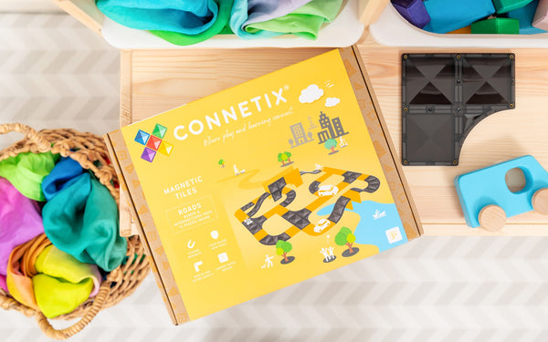 CONNETIX magnetic toy set with colorful pieces on a wooden surface