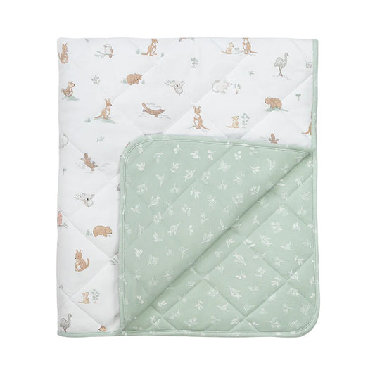 Quilted baby blanket with animal pattern on one side and solid color on the other, on a white background.