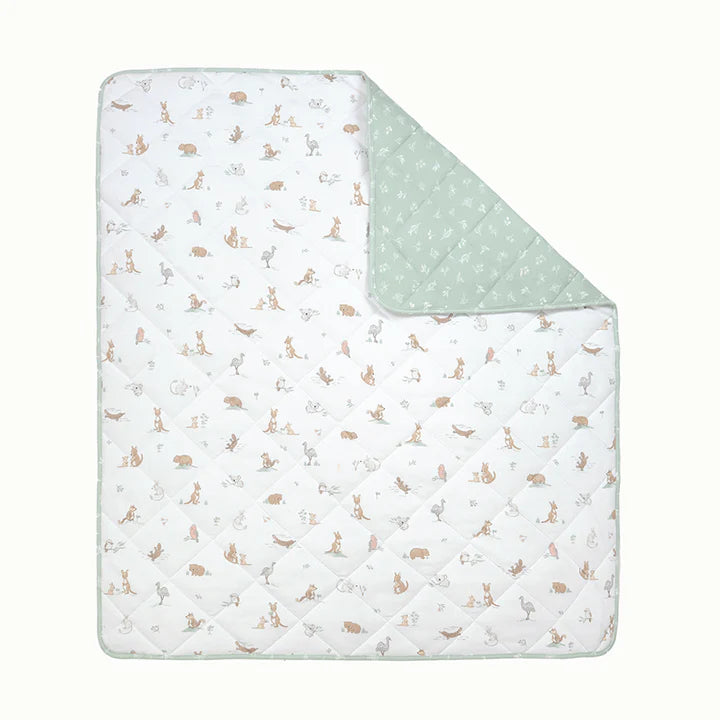 Baby blanket with animal pattern on one side and solid color on the other, on a white background