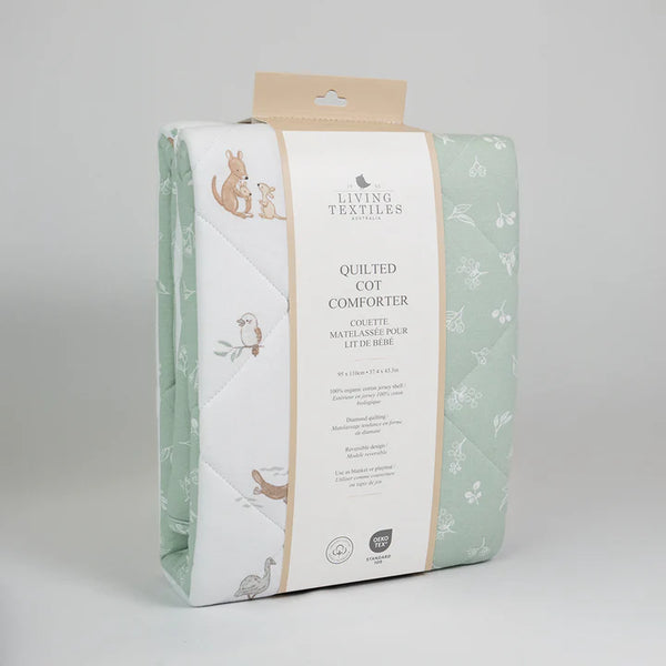 Quilted cot comforter packaging with brand logo on a gray background