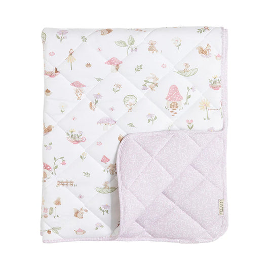 Quilted baby blanket with fairy tale design on a white background