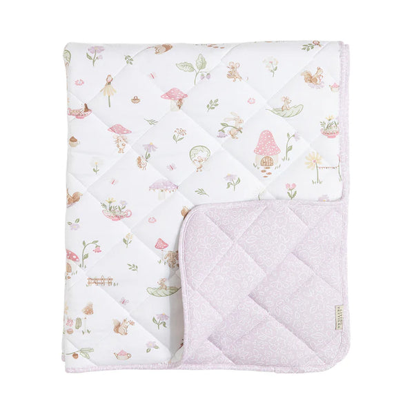 Quilted baby blanket with fairy tale design on a white background