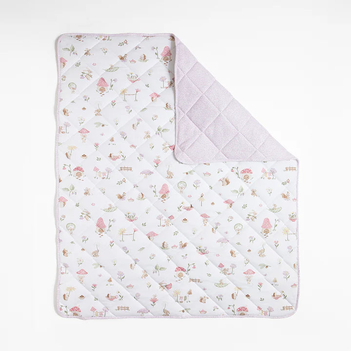 Quilted baby blanket with a floral pattern on a white background