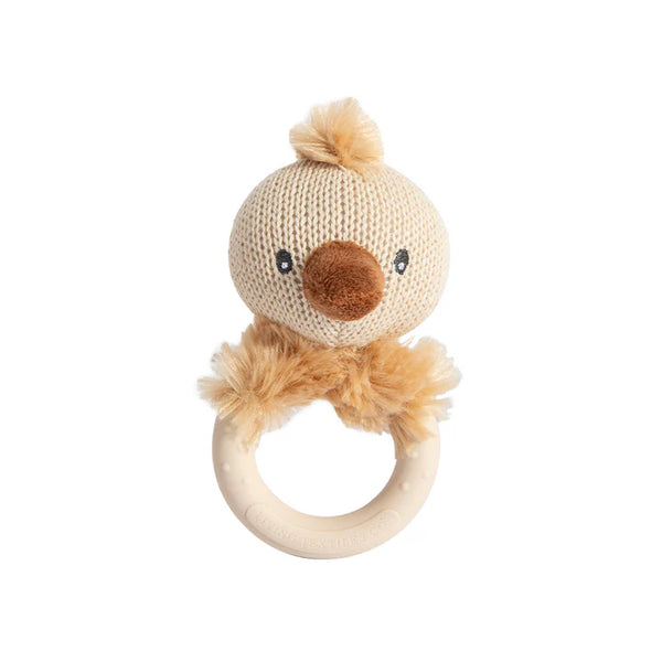Knitted baby rattle with a face on a light gray background