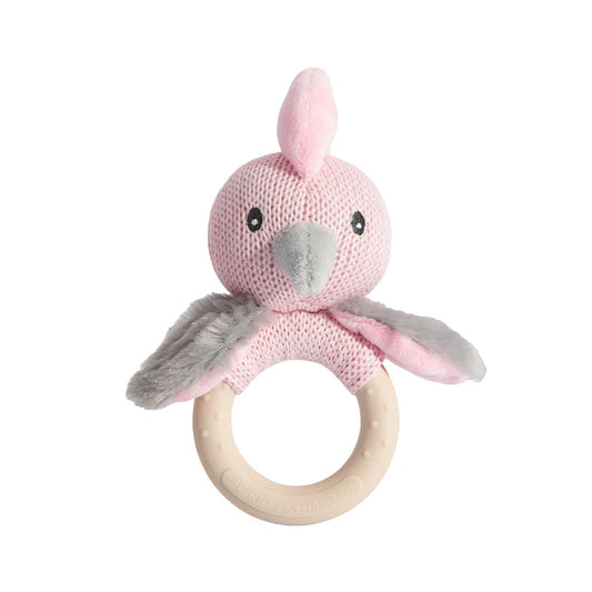 Pink knitted animal rattle with wooden ring on a white background