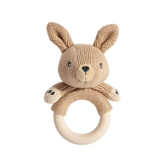 Knitted bunny rattle with wooden ring on a white background