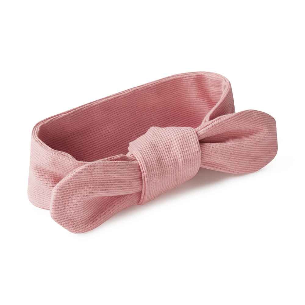 Pink headband with a bow on a white background