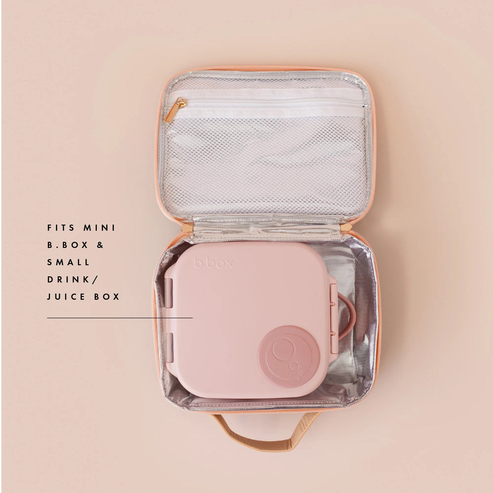 Pink travel case with a mesh interior on a beige background