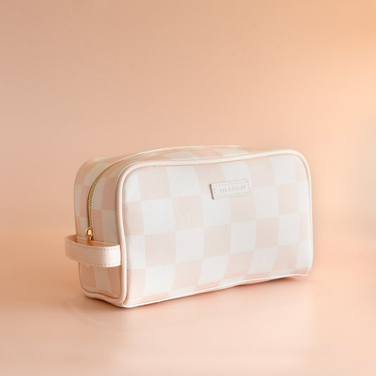 Cosmetic bag with a checkered pattern on a peach background