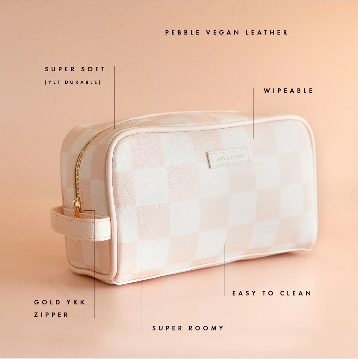 Cosmetic bag with features highlighted on a peach background