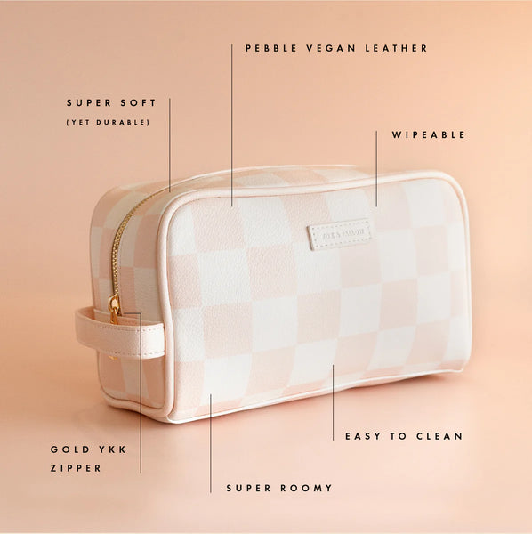 Cosmetic bag with features highlighted on a peach background