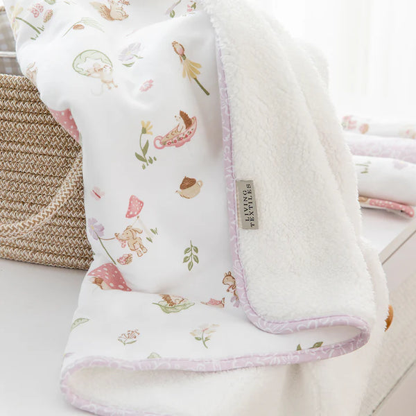 Floral patterned baby blanket with soft texture on a white background