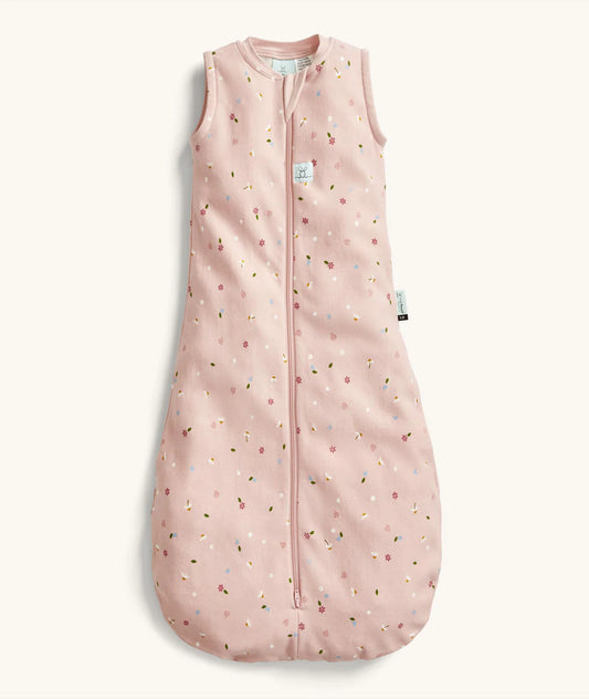 Pink baby sleeping bag with floral pattern on a white background