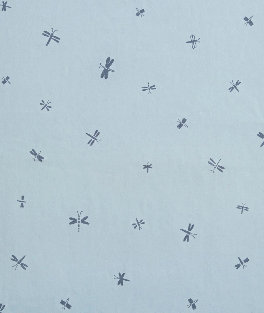 Pattern of dragonflies on a light blue background