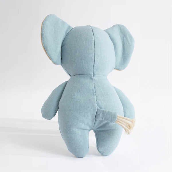 Light blue stuffed elephant toy on a white background