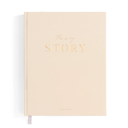 Beige notebook with 'This is my story' text on a white background