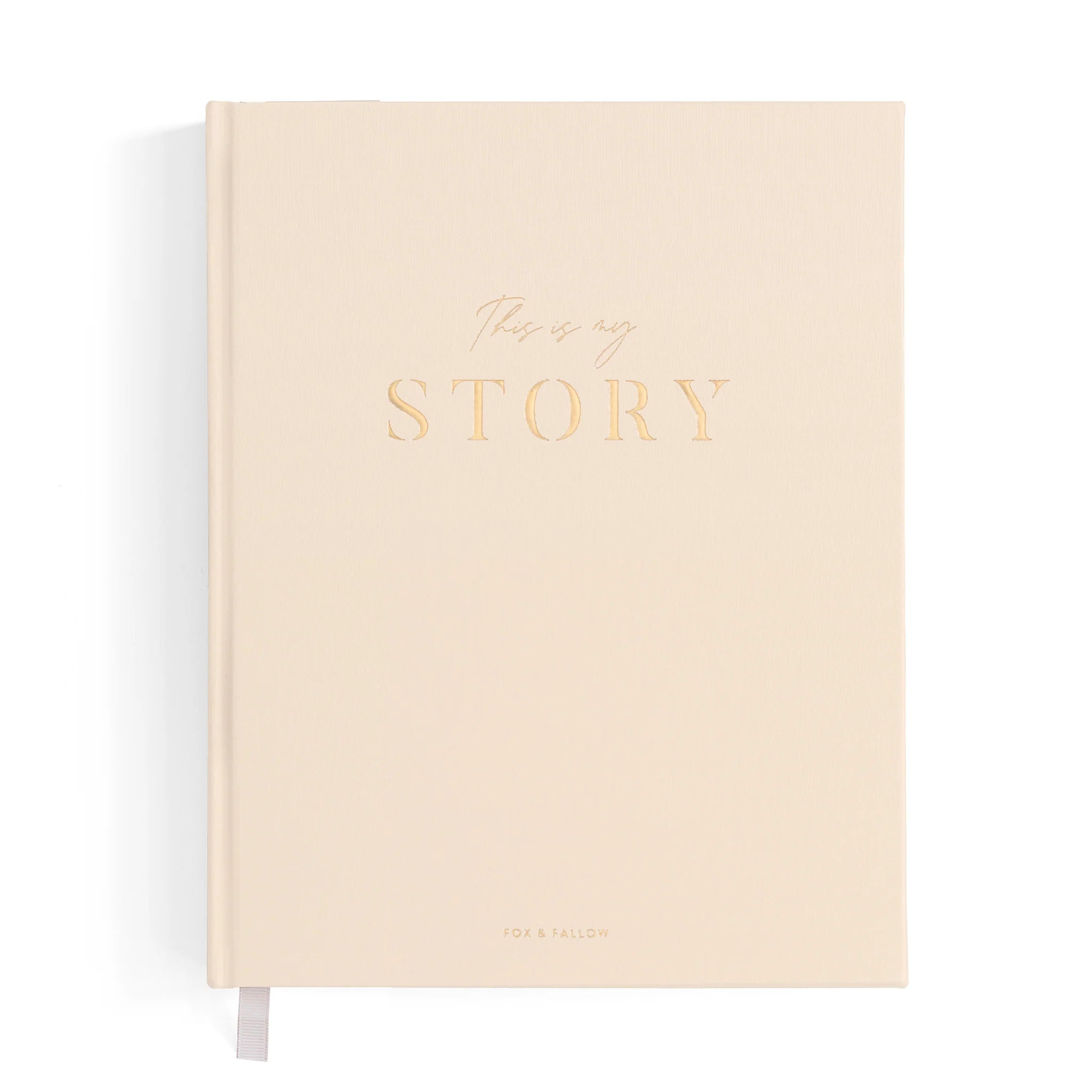 Beige notebook with 'This is my story' text on a white background