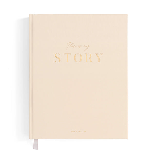 Beige notebook with 'This is my story' text on a white background