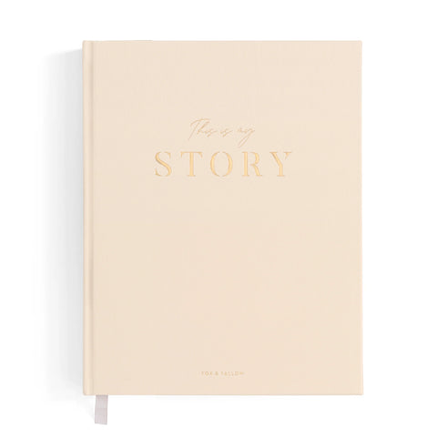Beige notebook with 'This is my story' text on a white background