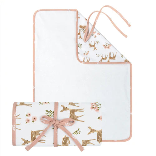 Baby blanket with deer and floral pattern, tied with a pink ribbon on a white background