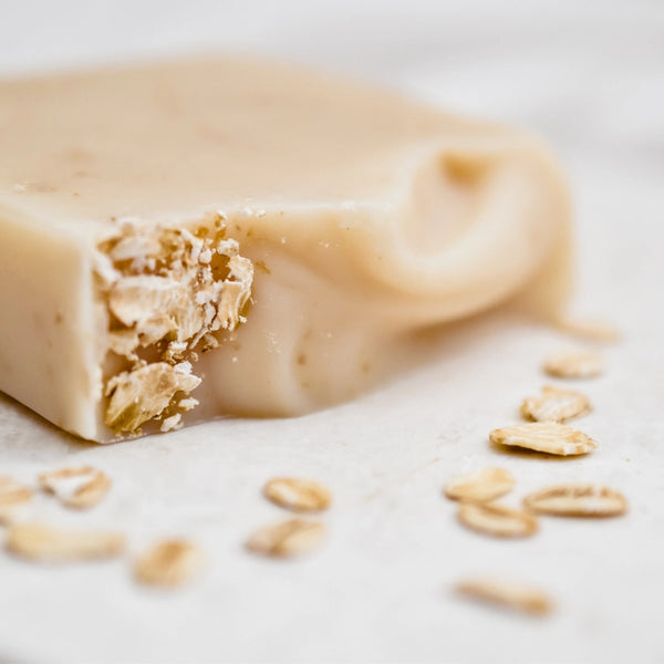 Close-up of a oatmeal cookie bar with oats on a light background