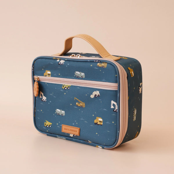 Blue lunch bag with construction vehicle pattern on a beige background