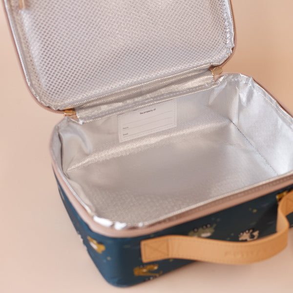 Open cooler bag with reflective interior on a beige background