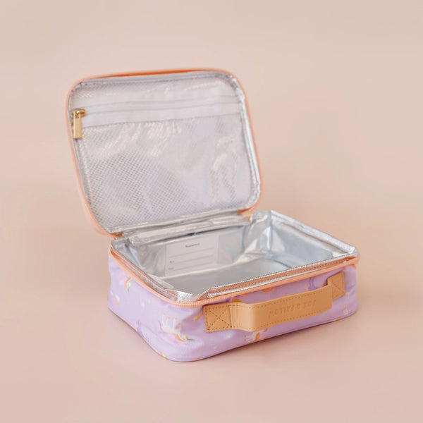 Open travel case with clear interior on a beige background