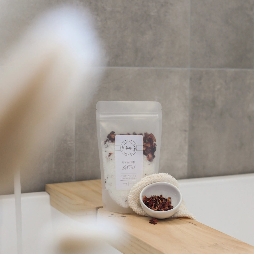 Bag of loose leaf tea on a wooden board with a blurred background