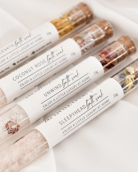 Set of bath soaks with labels on a white background