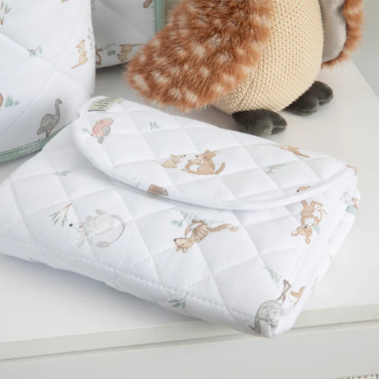 Quilted baby blanket with animal patterns on a white surface
