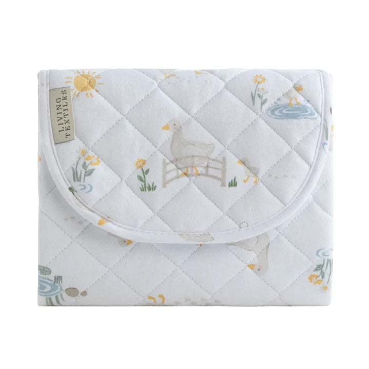 Quilted baby blanket with animal design on a white background