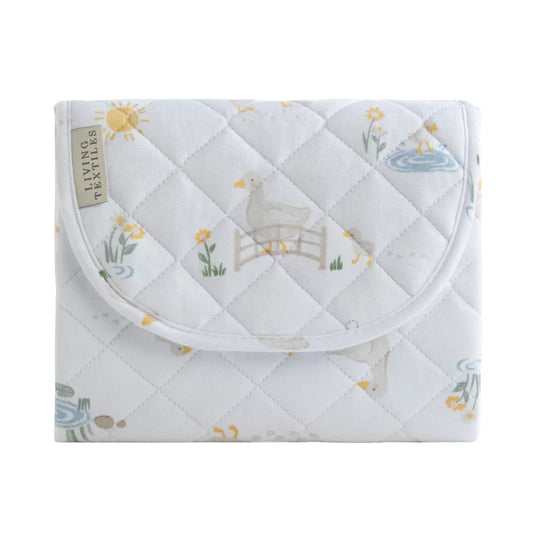 Quilted baby blanket with animal design on a white background
