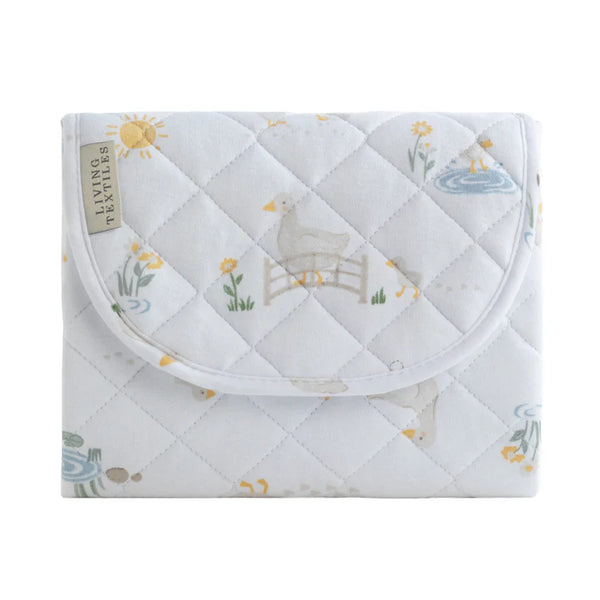 Quilted baby blanket with animal design on a white background
