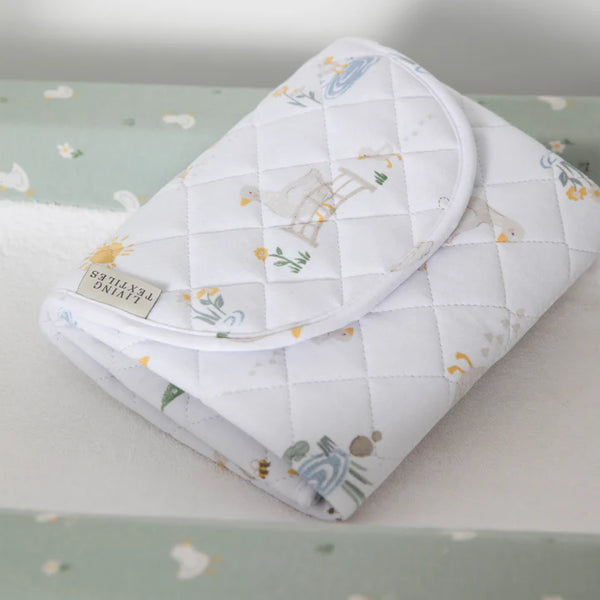 Baby blanket with animal pattern on a light green background