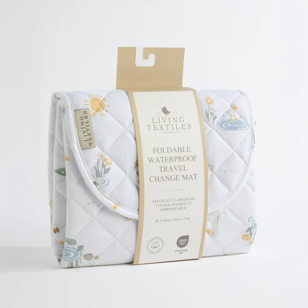 Foldable waterproof travel change mat with packaging on a white background