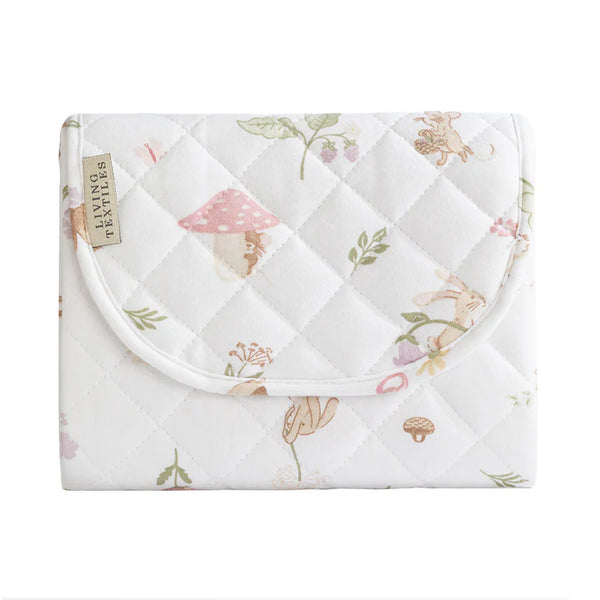 Floral-patterned quilt with diamond quilted design on a white background