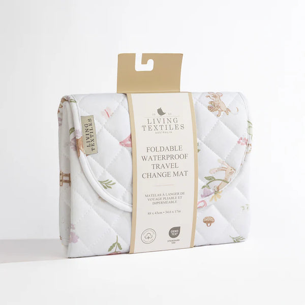 Foldable waterproof travel change mat with floral design and Living Textiles packaging on a white background